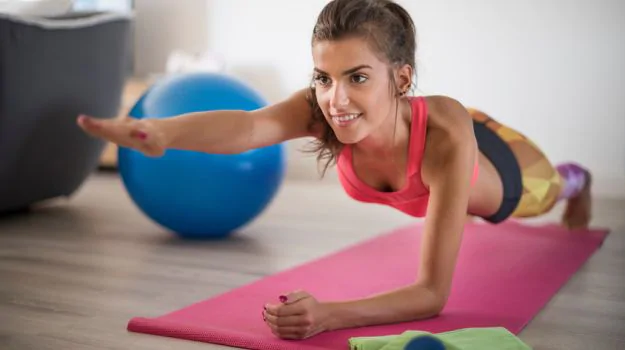 Woman exercising to look and feel less tired