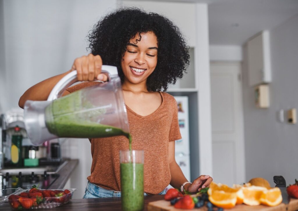 lady making a healthy smoothie