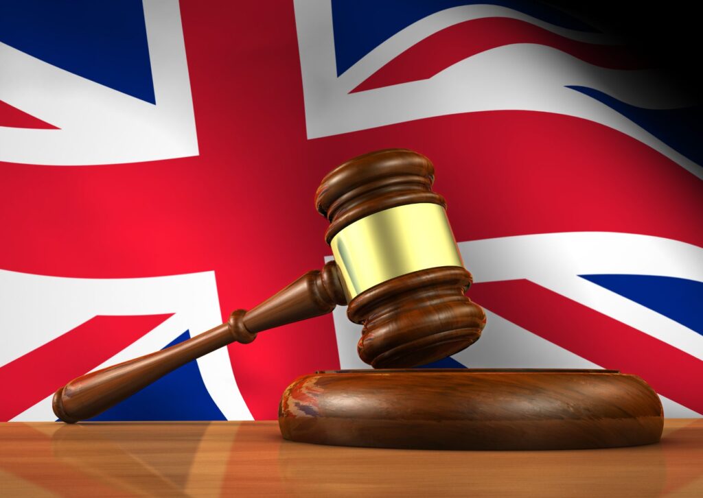 british-flag-with-judge-gavel-infront-of-it