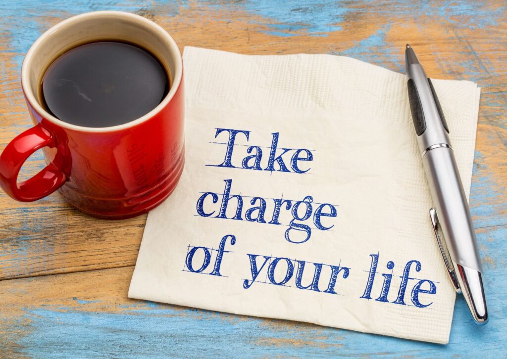 a coffee and a note that says take charge of your life