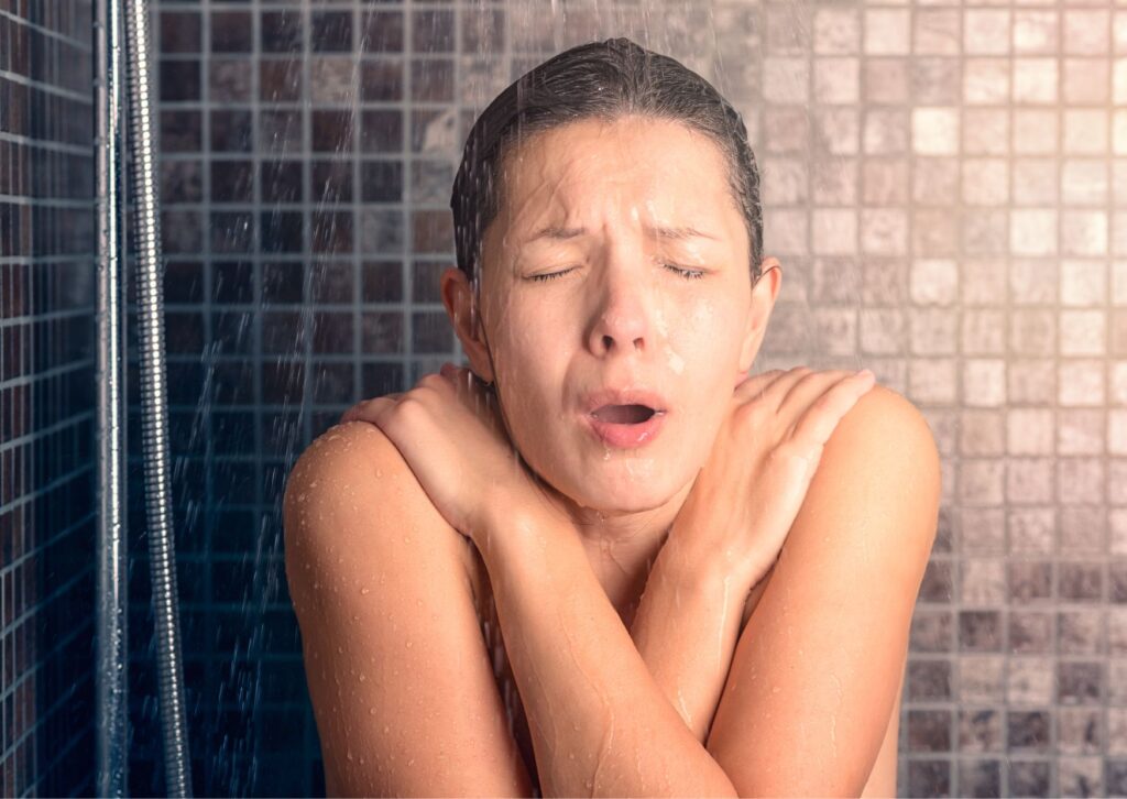 lady very cold in the shower