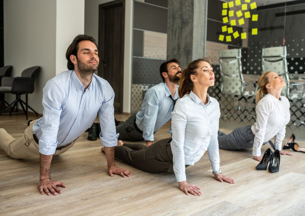 office employees stretching on the floor