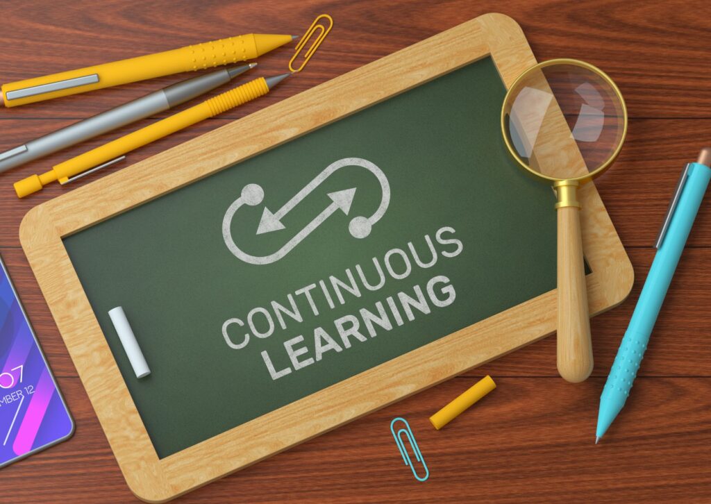 continuous learning written on a chalk board