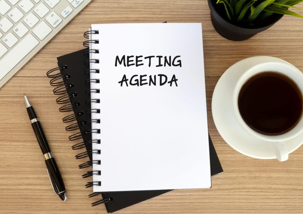 meeting agenda written on a notepad
