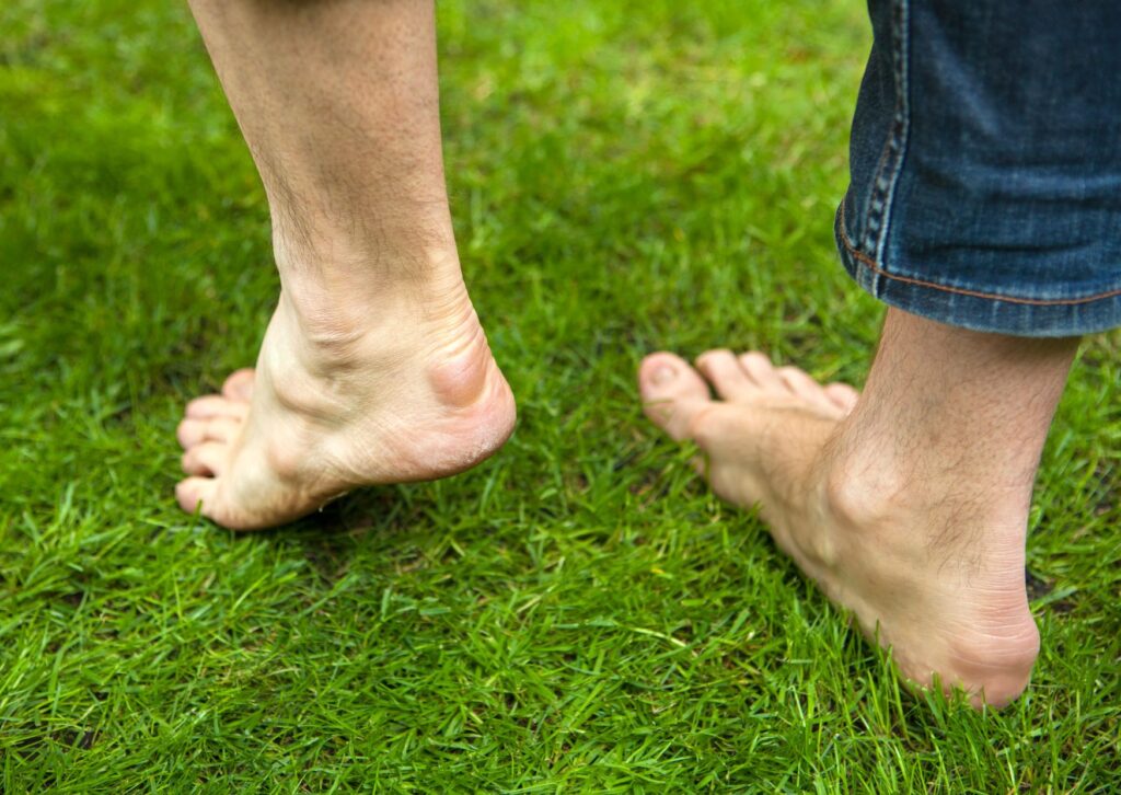 bare-feet-earthing-on-grass