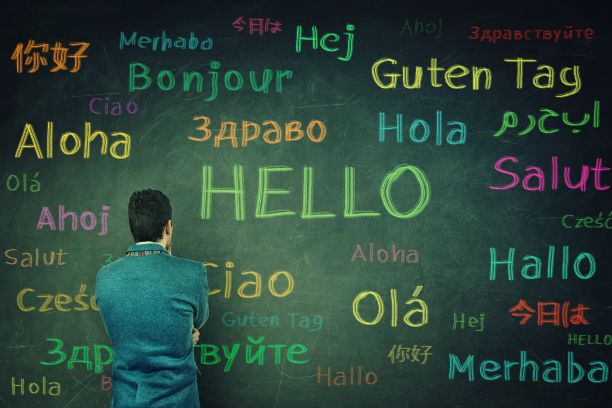 chalk board with multiple languages saying hello