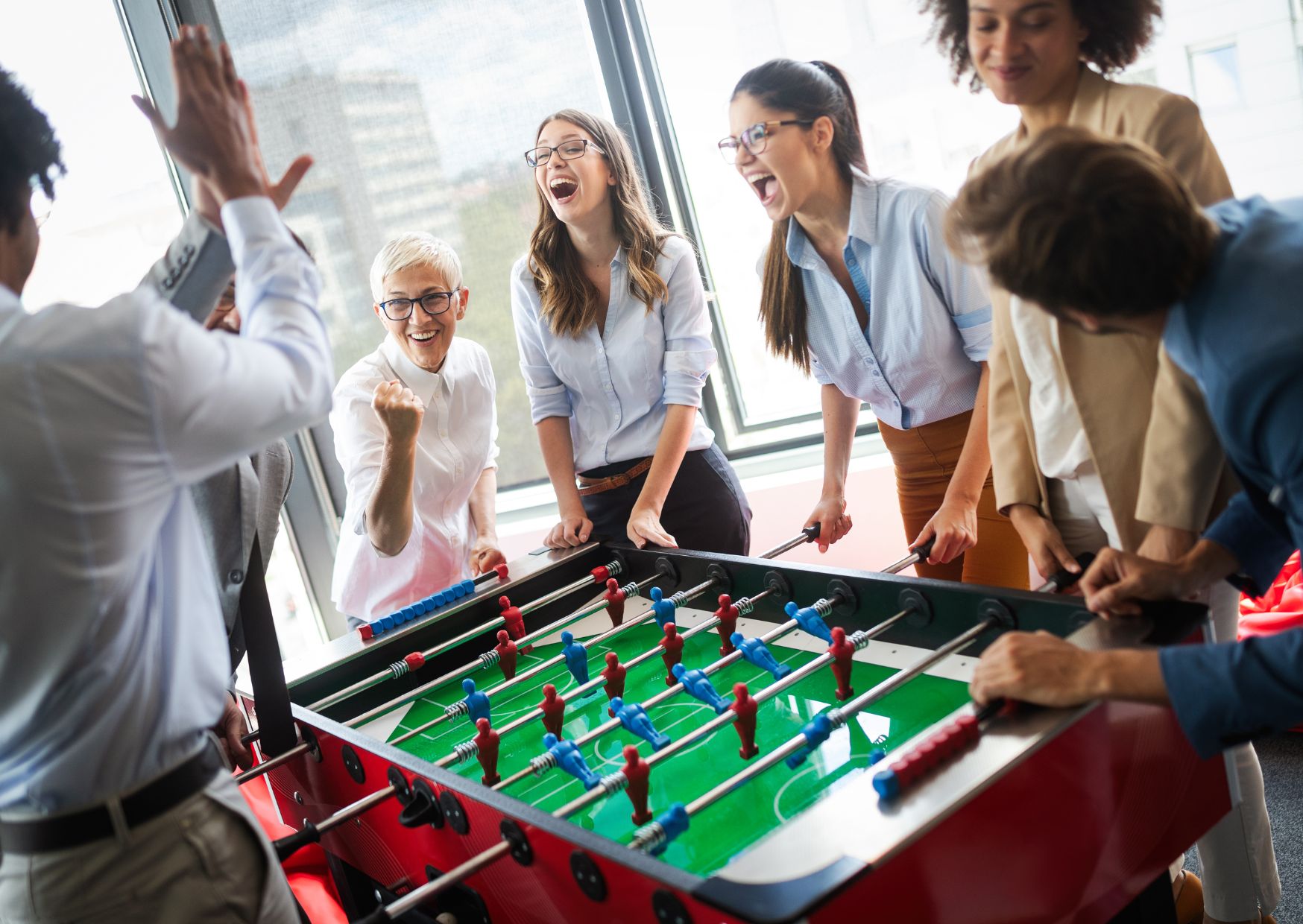 employee-teamwork-games-playing-table-football