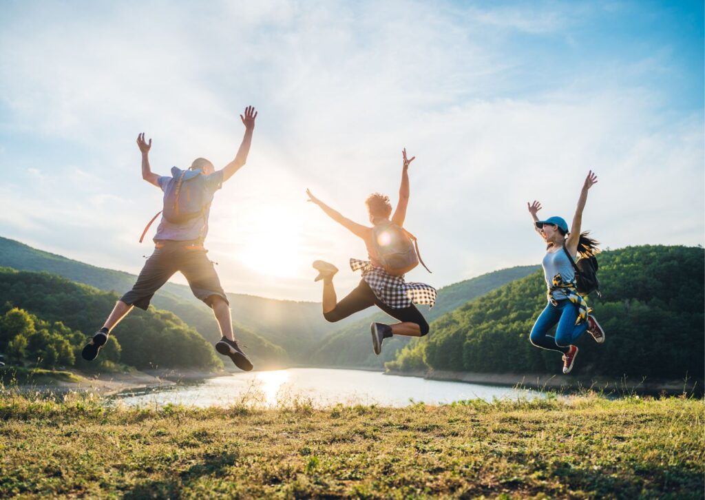 happy-people-jumping-outside-in-nature