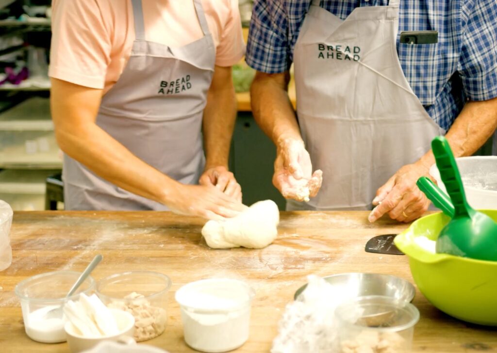 hands-with-dough-making-bread-at-bread-ahead-bakery-in-london
