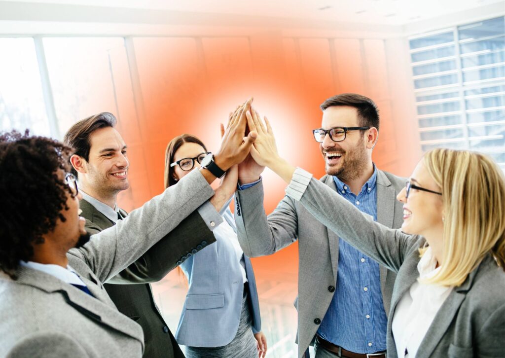 corporate-team-giving-each-other-a-high-five