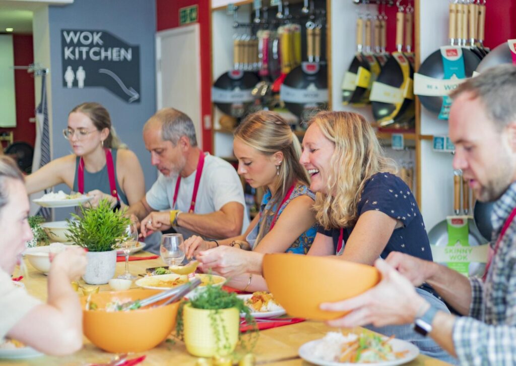 employees-at-school-of-wok-London-cooking-classes-laughing-and-having-a-good-time