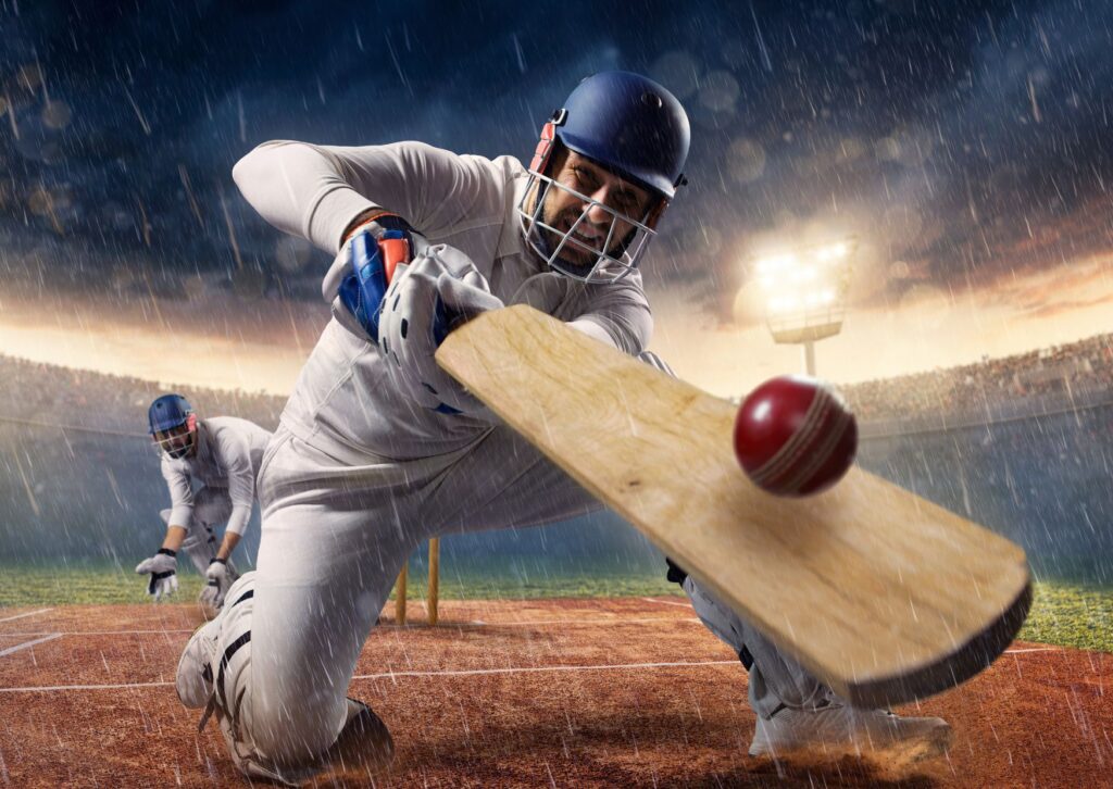 man-with-cricket-clothing-on-close-up-with-cricket-bat-and-cricket-ball-hitting-the-bat