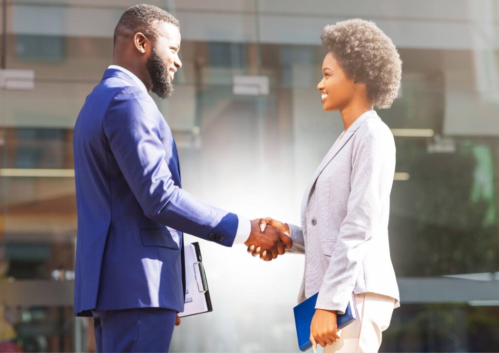 black-business-man-and-woman-shaking-hands