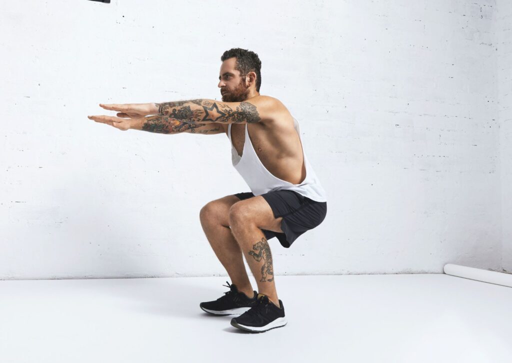 man-doing-a-bodyweight-squat