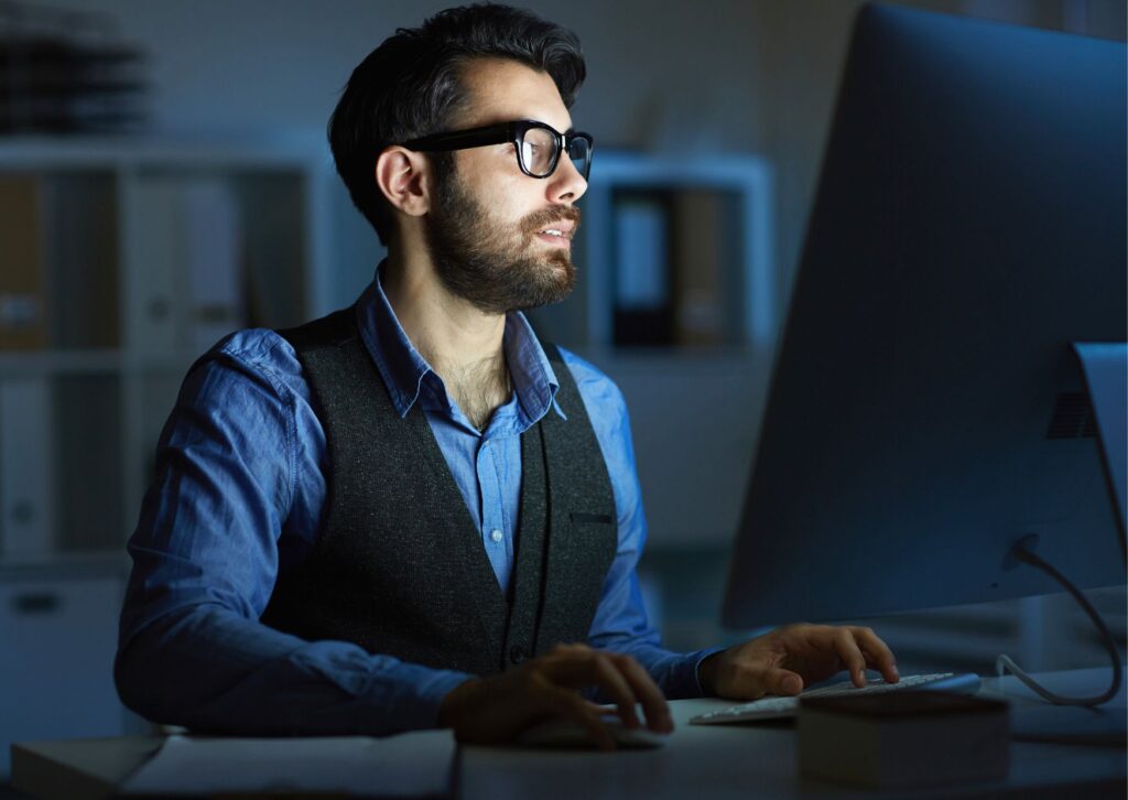 man-working-at-his-computer-late-at-night