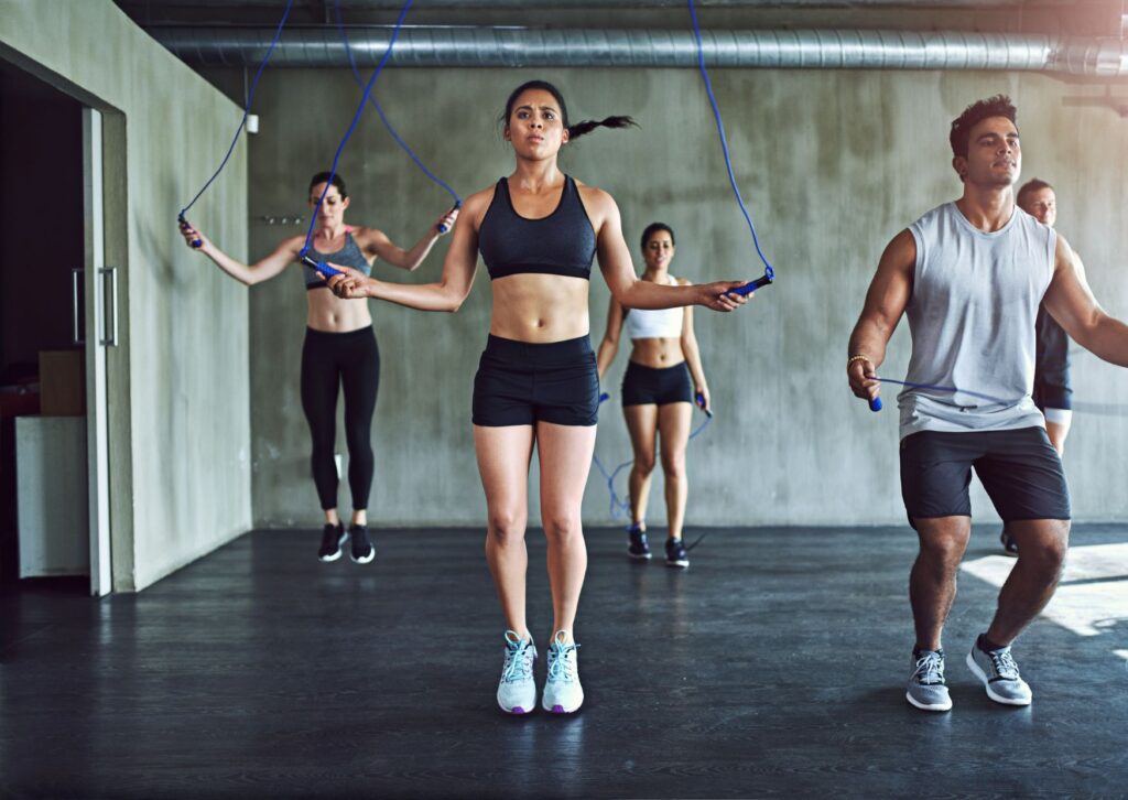 men-and-women-skipping-in-fitness-clothes-as-a-corporate-fitness-challenge
