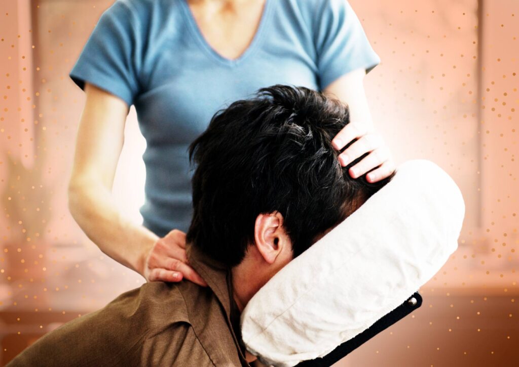 Man-getting-chair-massage-at-work-by-female-massage-therapist
