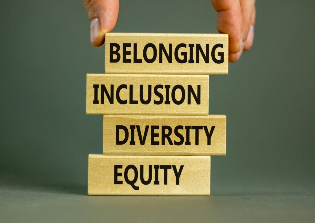 Belonging, inclusion, diversity and equity written on jenga blocks