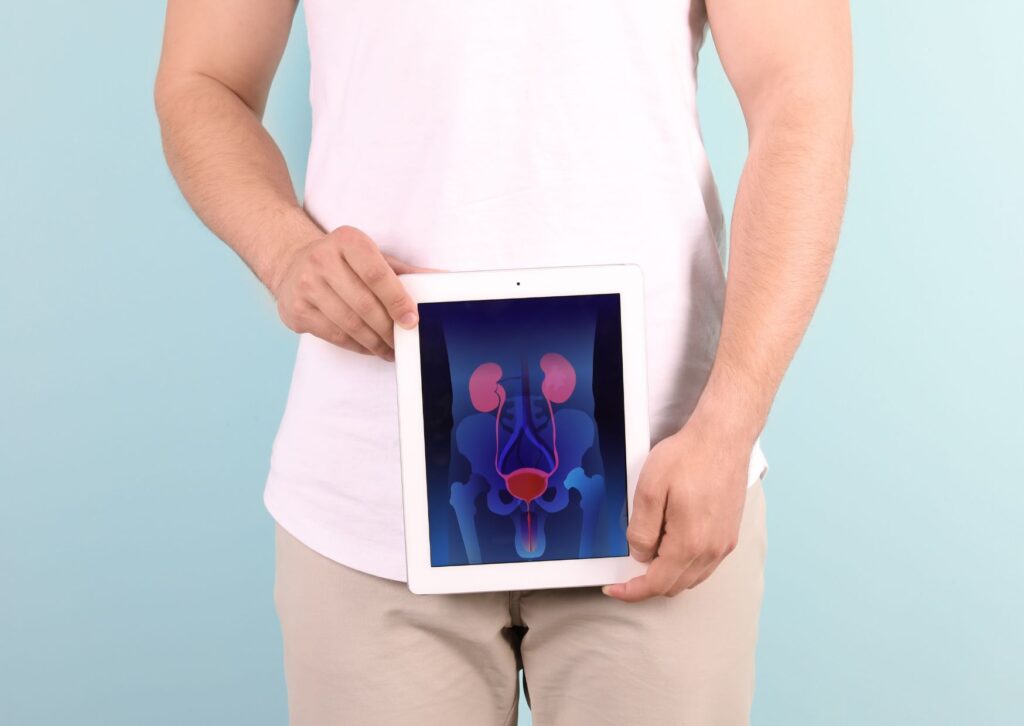 man-holding-an-ipad-near-groin-area-with-image-of-prostate-and-what-it-looks-like