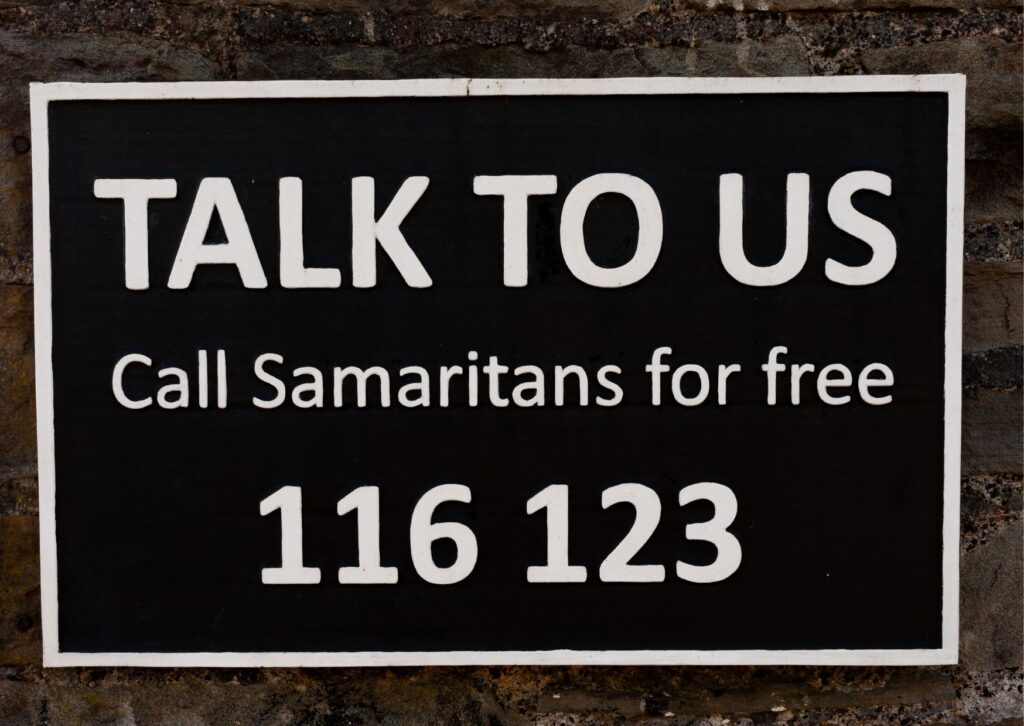 talk-to-us-sign-with-phone-number-to-call-samaritans-charity