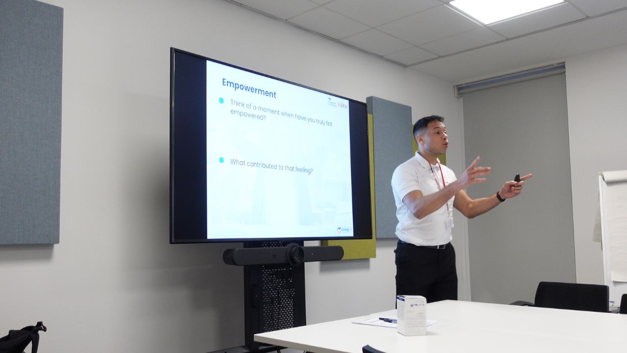 Facilitator leading an empowerment workshop with employees.