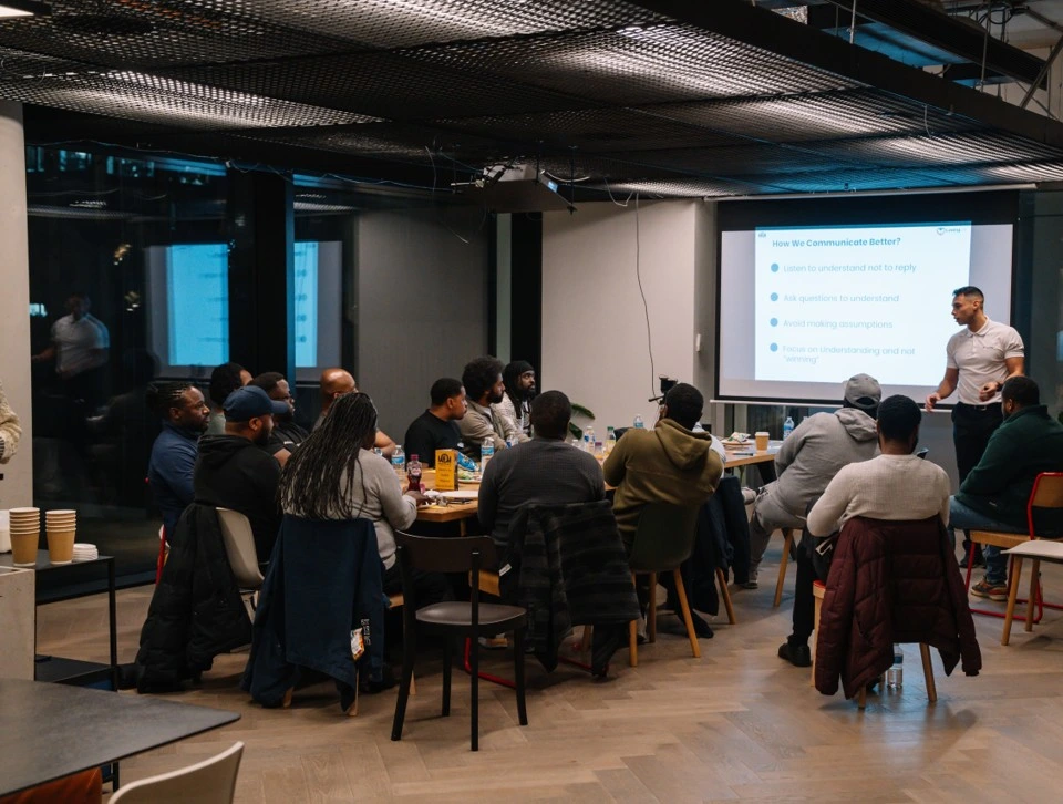 Facilitator delivering a Men’s Health Awareness workshop to employees.
