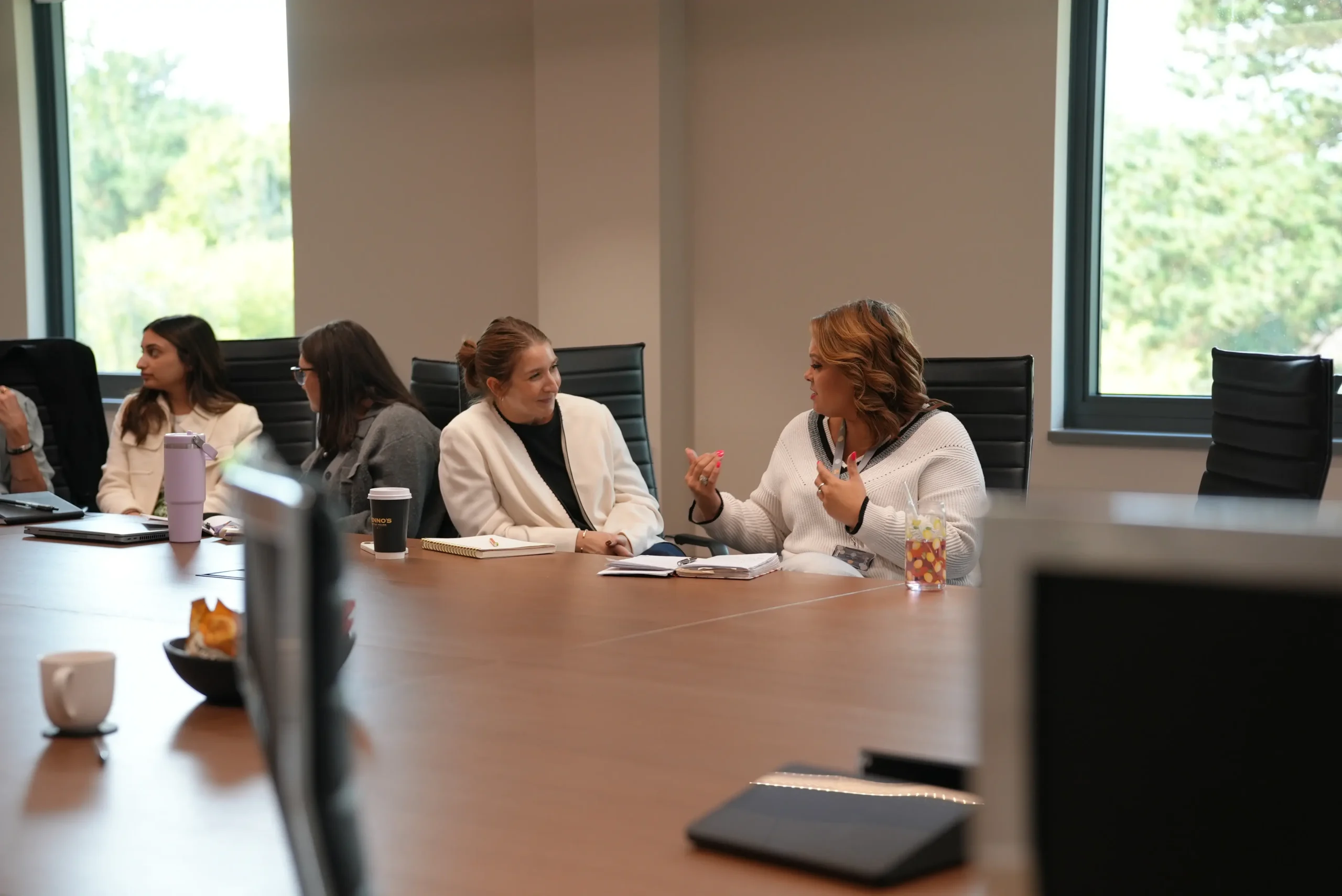 Colleagues discussing ideas during a team workshop activity.