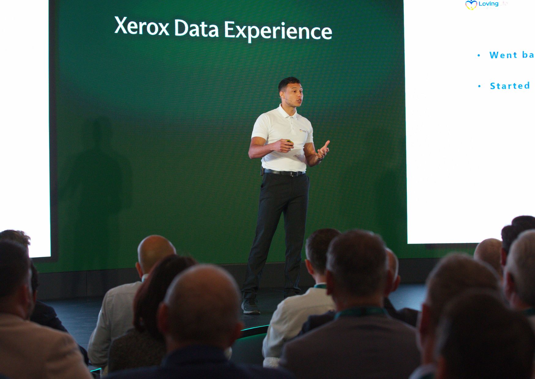 Ronan delivering a keynote talk on wellbeing at a Xerox data conference.