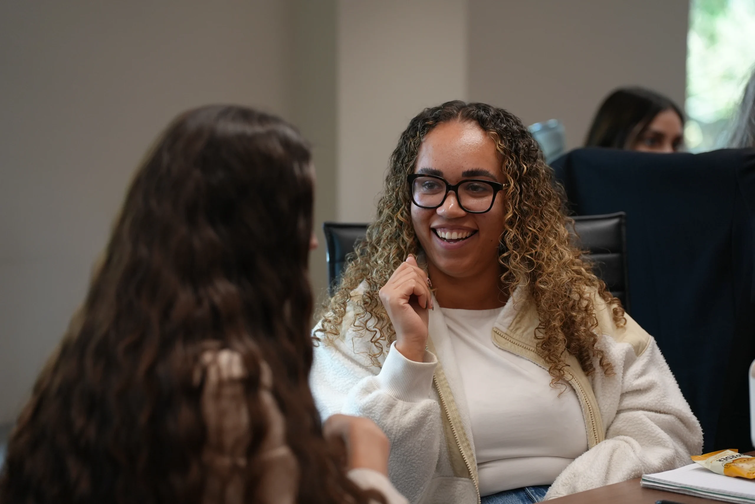 Participant smiling during a team away day workshop with Loving Life.