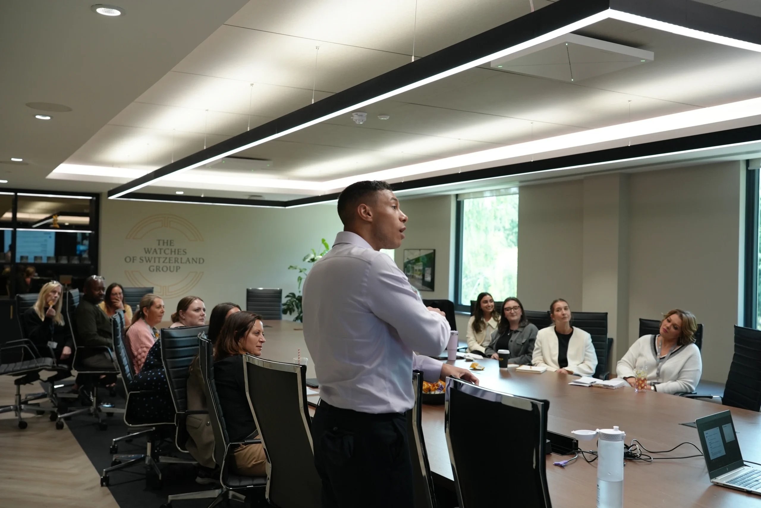 Room of employees engaged in a team workshop with Loving Life.