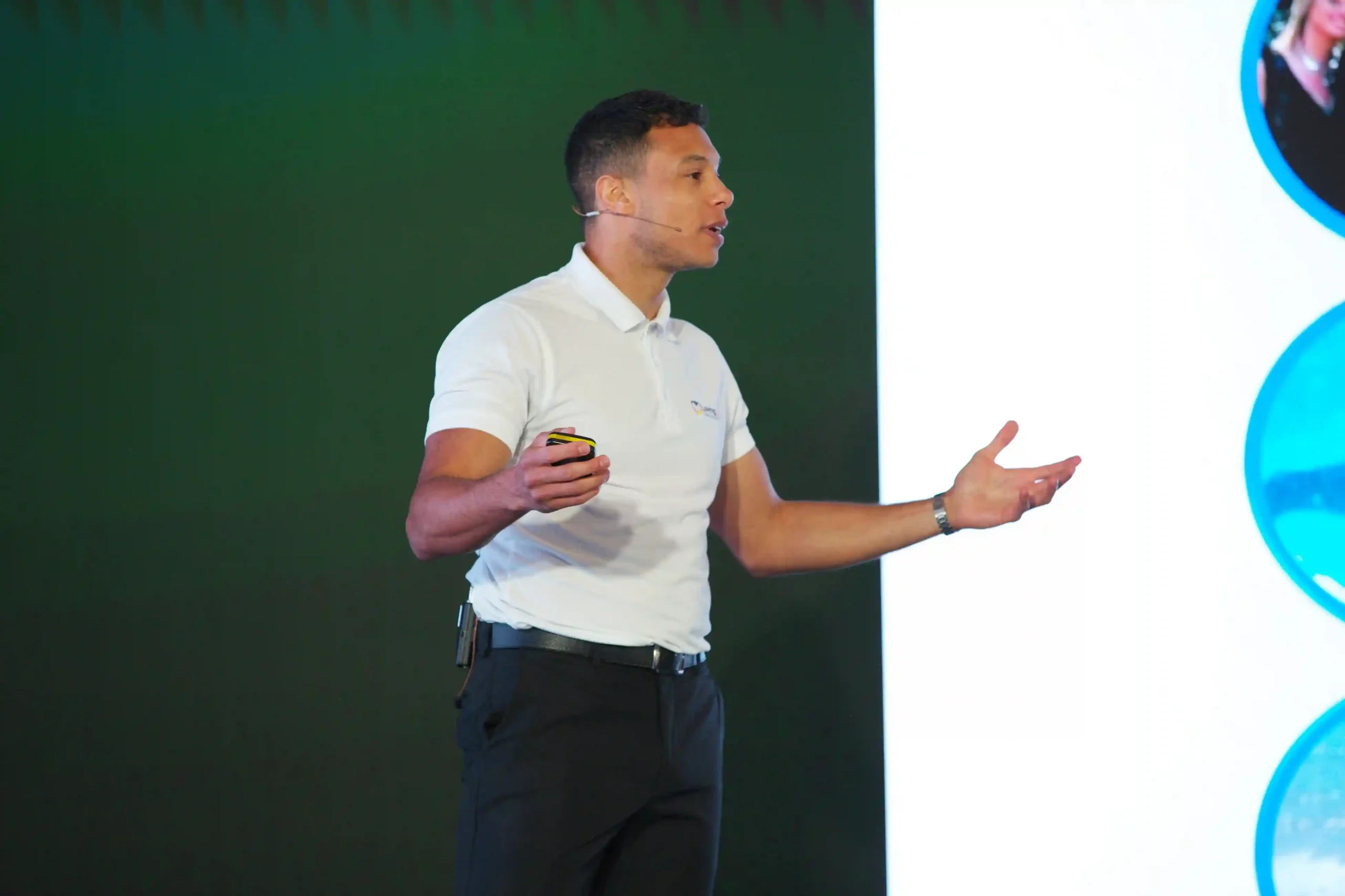 Thumbnail: wellbeing speaker Tyler Lowe delivering a keynote.
